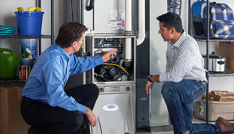 Technician evaluating a furnace for repair or replacement in Arcadia
