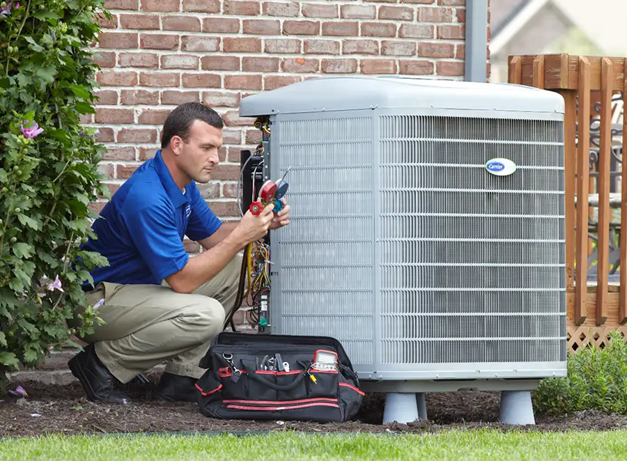 HVAC technician inspecting an outdoor AC unit in Arcadia