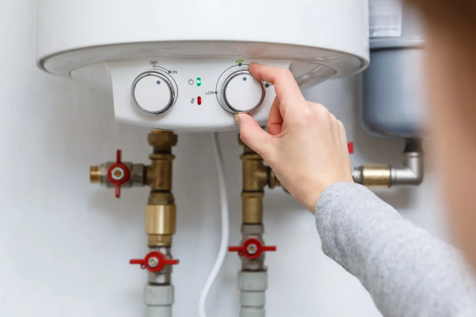 Technician adjusting a water heater in Arcadia
